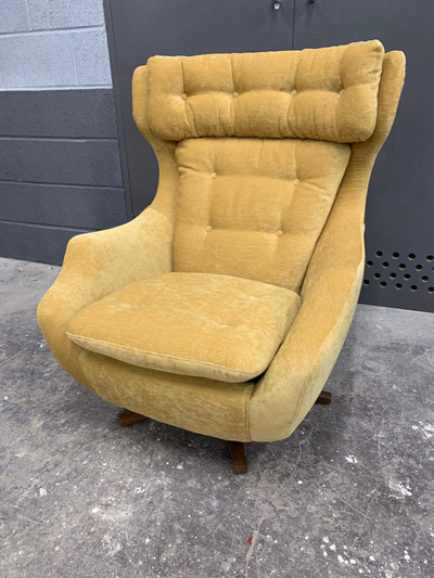 Yellow suede Parker Knoll upholstered armchair.